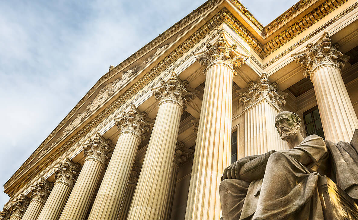 A courthouse and statue.